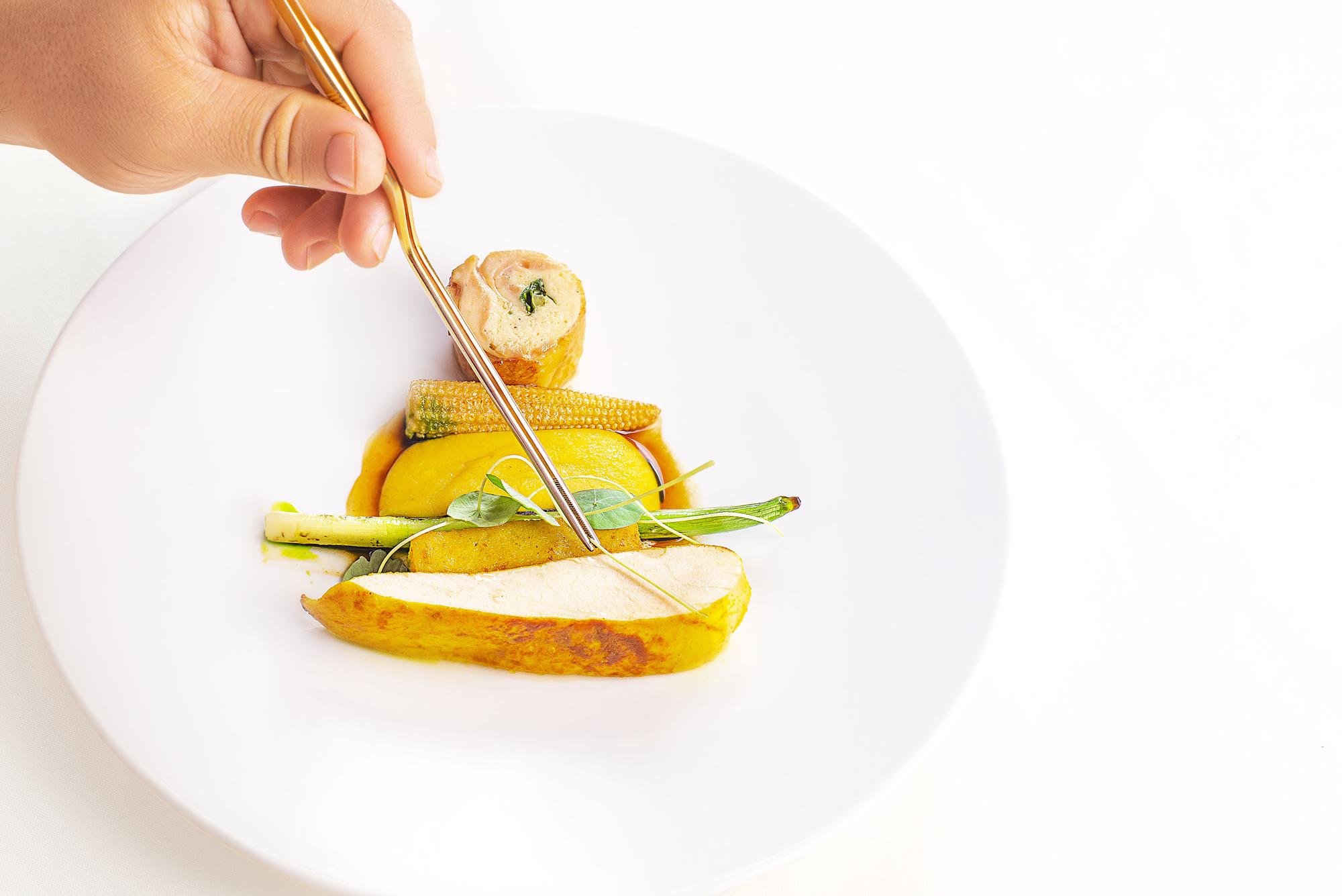 Student tasting plated dish